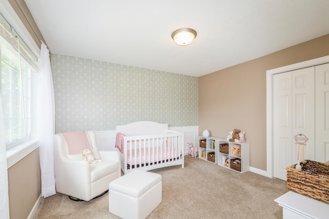 13284 288th Ave NW, Zimmerman, MN 55398 - bedroom with wallpapered walls, carpet floors, a closet, and baseboards