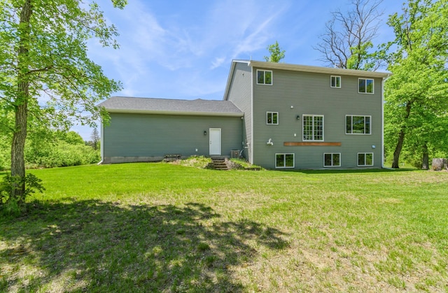 13284 288th Ave NW, Zimmerman, MN 55398 - rear view of house featuring a lawn
