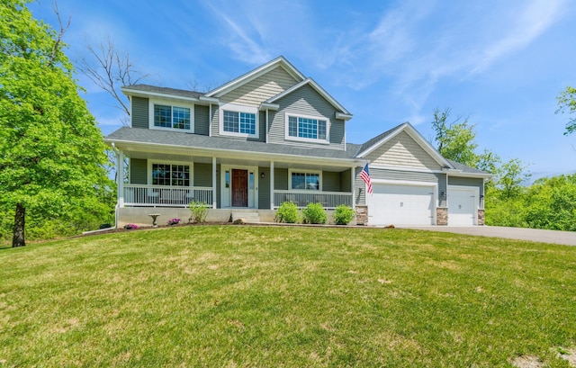 13284 288th Ave NW, Zimmerman, MN 55398 - view of front of house featuring an attached garage, driveway, covered porch, a front yard, and stone siding