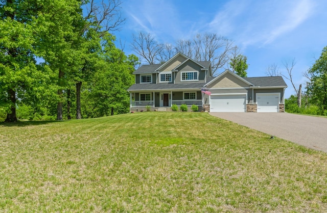 13284 288th Ave NW, Zimmerman, MN 55398 - view of front of house with a garage, a porch, driveway, a front lawn, and stone siding
