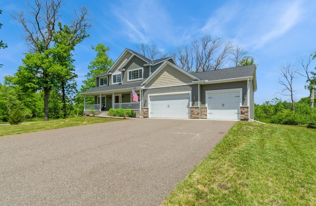 13284 288th Ave NW, Zimmerman, MN 55398 - view of front of house featuring a porch, stone siding, driveway, and a front yard
