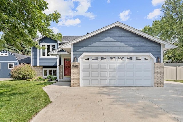 1112 Dakota St S, Shakopee, MN 55379 - view of front of home with brick siding, concrete driveway, and an attached garage
