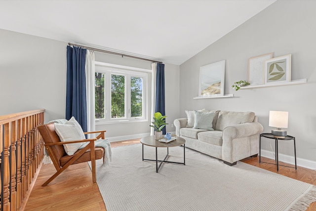 1112 Dakota St S, Shakopee, MN 55379 - living room with vaulted ceiling, light wood finished floors, and baseboards