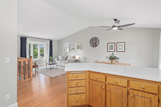 1112 Dakota St S, Shakopee, MN 55379 - kitchen featuring ceiling fan, light countertops, lofted ceiling, light wood finished floors, and open floor plan