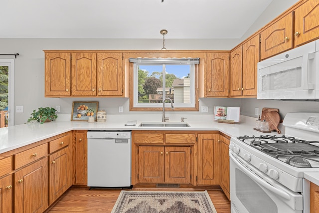 1112 Dakota St S, Shakopee, MN 55379 - kitchen with white appliances, a sink, and light countertops
