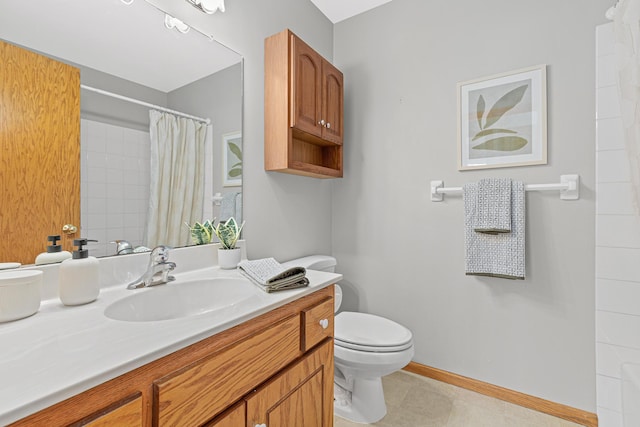 1112 Dakota St S, Shakopee, MN 55379 - bathroom featuring toilet, vanity, curtained shower, baseboards, and tile patterned floors