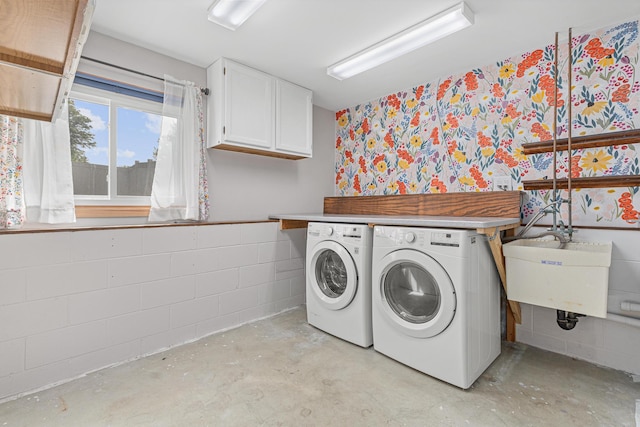 1112 Dakota St S, Shakopee, MN 55379 - laundry room featuring independent washer and dryer, cabinet space, and concrete block wall