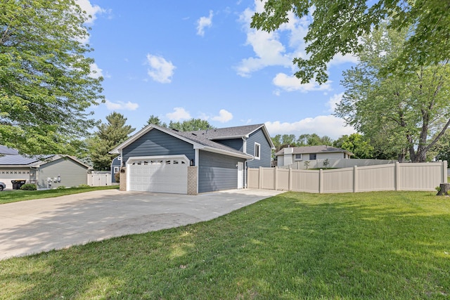 1112 Dakota St S, Shakopee, MN 55379 - view of front of house with driveway, an attached garage, and brick siding