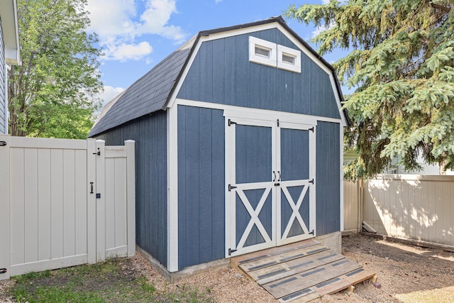 1112 Dakota St S, Shakopee, MN 55379 - view of shed with a fenced backyard and a gate