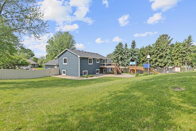 1112 Dakota St S, Shakopee, MN 55379 - rear view of property with a playground and a wooden deck
