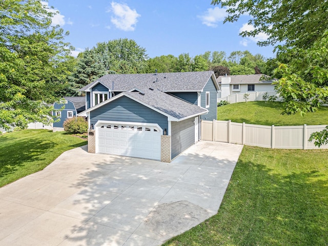 1112 Dakota St S, Shakopee, MN 55379 - view of front facade with brick siding, roof with shingles, concrete driveway, and a garage