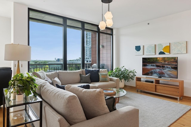 215 10th Ave S Unit 606, Minneapolis, MN 55415 - living area with wood finished floors and floor to ceiling windows
