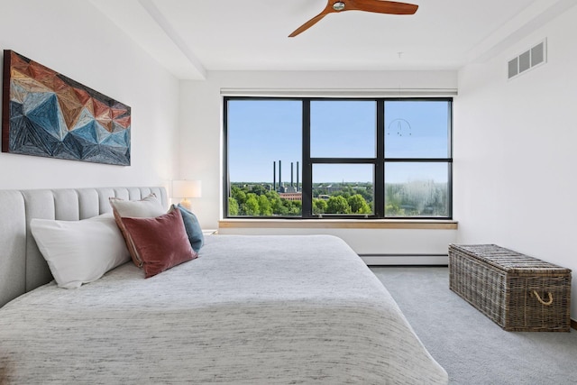 215 10th Ave S Unit 606, Minneapolis, MN 55415 - bedroom with baseboard heating, carpet, and a ceiling fan