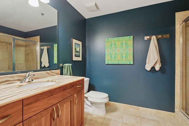 215 10th Ave S Unit 606, Minneapolis, MN 55415 - bathroom with vanity, a stall shower, and tile patterned flooring