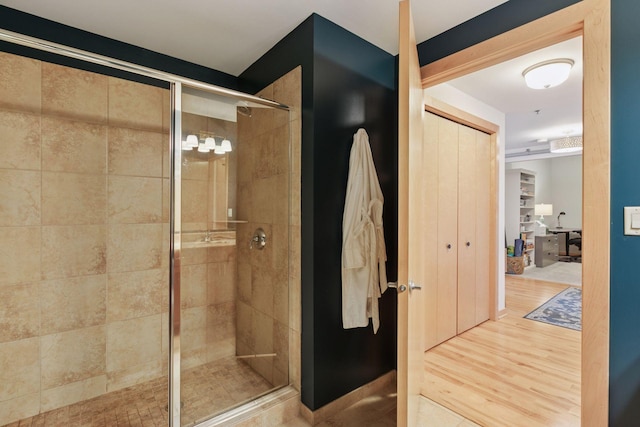 215 10th Ave S Unit 606, Minneapolis, MN 55415 - bathroom with a stall shower and wood finished floors