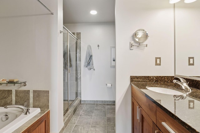 215 10th Ave S Unit 606, Minneapolis, MN 55415 - bathroom featuring a stall shower, vanity, and a bath