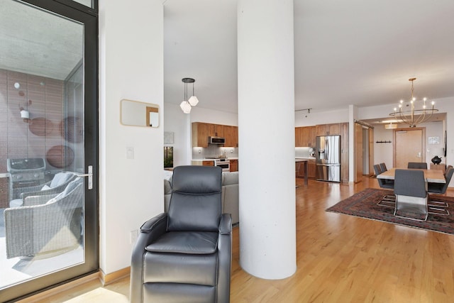 215 10th Ave S Unit 606, Minneapolis, MN 55415 - sitting room with a chandelier and light wood finished floors