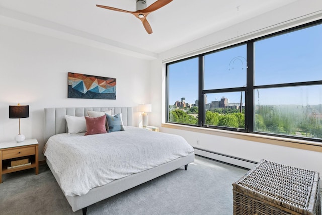 215 10th Ave S Unit 606, Minneapolis, MN 55415 - bedroom with baseboard heating, carpet flooring, a ceiling fan, and a view of city