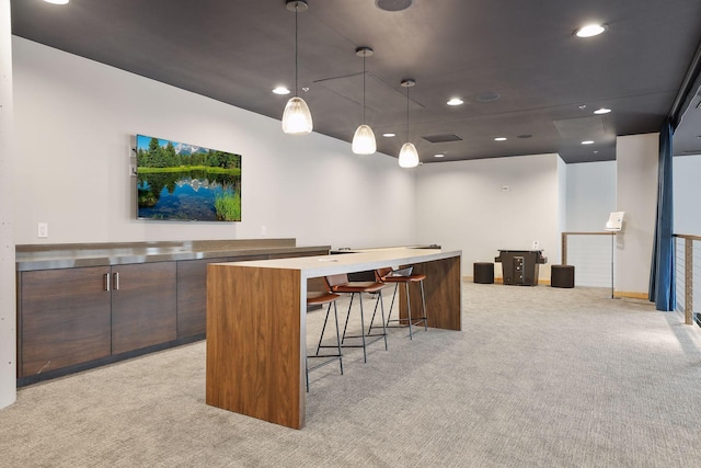 215 10th Ave S Unit 606, Minneapolis, MN 55415 - bar featuring light colored carpet, recessed lighting, and decorative light fixtures