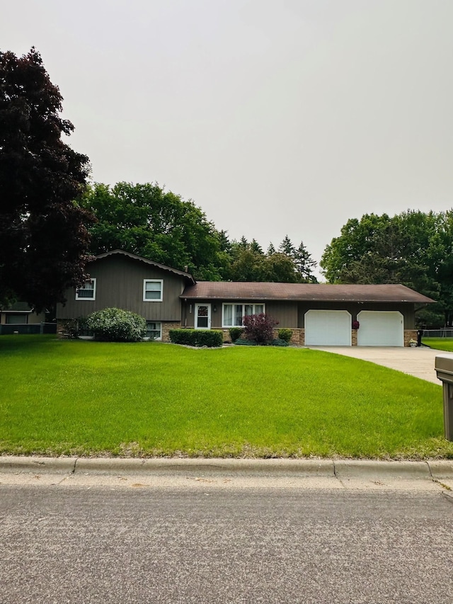 11732 Virginia Ave N, Champlin, MN 55316 - view of front of home featuring a front lawn, an attached garage, and concrete driveway