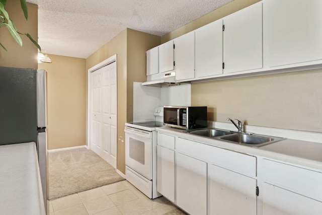 4130 Rahn Rd Unit 209, Eagan, MN 55122 - kitchen with appliances with stainless steel finishes, a sink, under cabinet range hood, white cabinetry, and light countertops