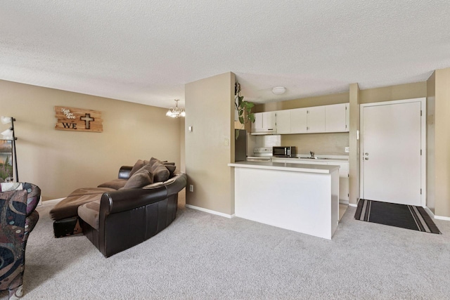 4130 Rahn Rd Unit 209, Eagan, MN 55122 - living room featuring light colored carpet, a textured ceiling, and a chandelier