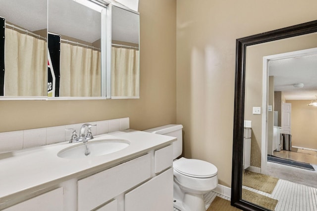4130 Rahn Rd Unit 209, Eagan, MN 55122 - bathroom with toilet, vanity, and tile patterned flooring