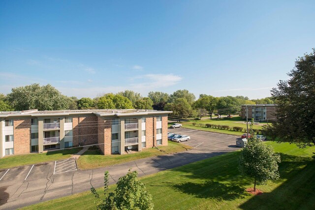 4130 Rahn Rd Unit 209, Eagan, MN 55122 - view of building exterior with uncovered parking