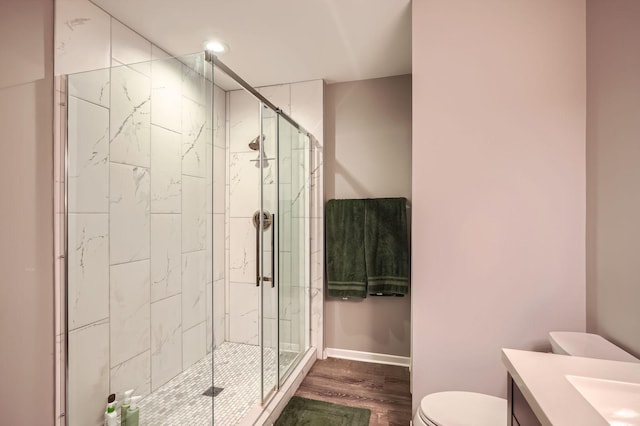 4271 Boulder Ridge Pt, Eagan, MN 55122 - bathroom featuring toilet, a stall shower, vanity, wood finished floors, and baseboards