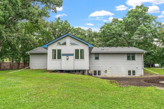 16724 Kenyon Cir NE, Ham Lake, MN 55304 - back of property featuring roof with shingles and view of wooded area