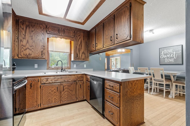 16724 Kenyon Cir NE, Ham Lake, MN 55304 - kitchen featuring dishwasher, range with electric stovetop, a peninsula, light wood-style floors, and a textured ceiling