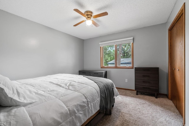 16724 Kenyon Cir NE, Ham Lake, MN 55304 - bedroom with light colored carpet, a closet, a textured ceiling, and ceiling fan
