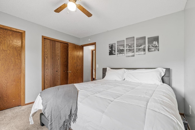 16724 Kenyon Cir NE, Ham Lake, MN 55304 - bedroom with a closet, carpet, a textured ceiling, and ceiling fan