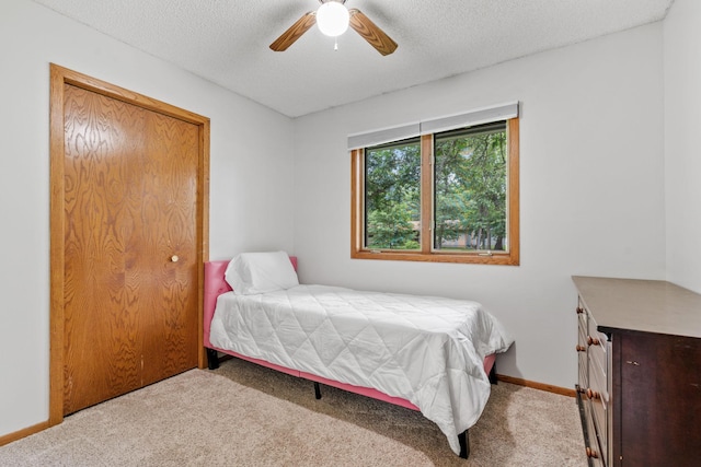 16724 Kenyon Cir NE, Ham Lake, MN 55304 - bedroom with carpet, a textured ceiling, and ceiling fan