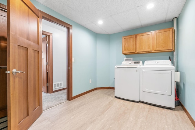 16724 Kenyon Cir NE, Ham Lake, MN 55304 - laundry room with cabinet space, light wood-type flooring, washer and dryer, and recessed lighting