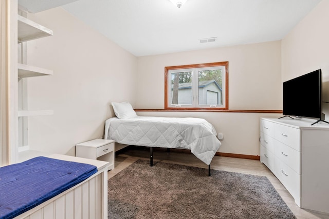 16724 Kenyon Cir NE, Ham Lake, MN 55304 - bedroom featuring light wood-type flooring and baseboards