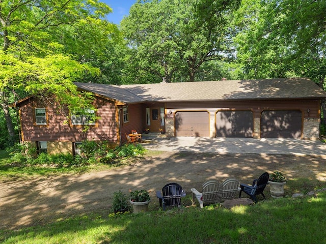 24810 96th St NW, Zimmerman, MN 55398 - view of front of property with dirt driveway, a garage, and a shingled roof
