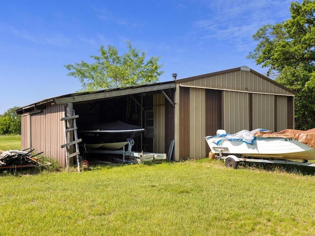 24810 96th St NW, Zimmerman, MN 55398 - view of pole building with a lawn
