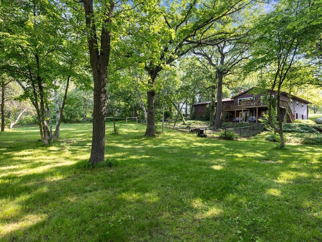 24810 96th St NW, Zimmerman, MN 55398 - view of green lawn featuring stairs and a deck