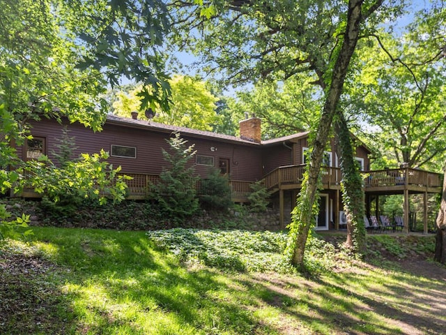 24810 96th St NW, Zimmerman, MN 55398 - rear view of house featuring a chimney and a wooden deck