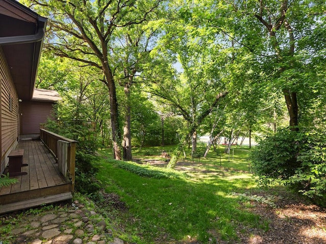 24810 96th St NW, Zimmerman, MN 55398 - view of green lawn with a wooden deck