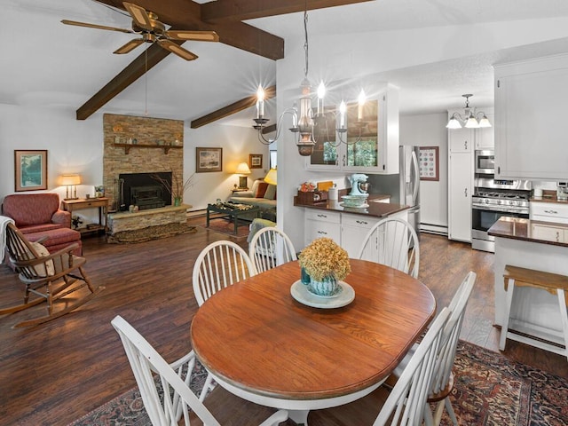 24810 96th St NW, Zimmerman, MN 55398 - dining area with dark wood-style flooring, a ceiling fan, a fireplace, a chandelier, and a baseboard radiator