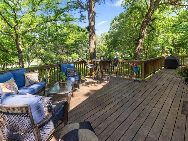 24810 96th St NW, Zimmerman, MN 55398 - wooden deck with outdoor lounge area, outdoor dining space, grilling area, and view of wooded area