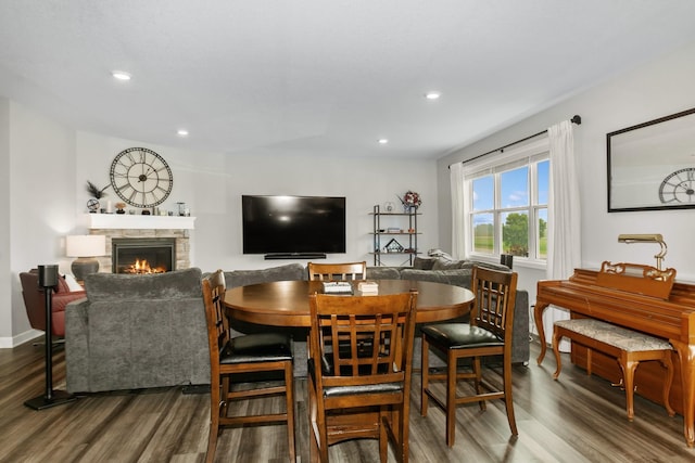 19281 Blue Stem Ct, Maple Grove, MN 55311 - dining room with wood finished floors, a stone fireplace, recessed lighting, and baseboards