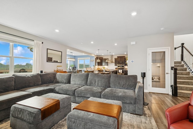 19281 Blue Stem Ct, Maple Grove, MN 55311 - living area with wood finished floors, stairs, and recessed lighting