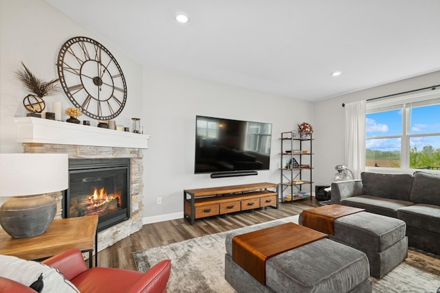 19281 Blue Stem Ct, Maple Grove, MN 55311 - living area featuring wood finished floors, a stone fireplace, recessed lighting, and baseboards