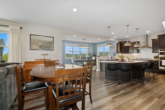 19281 Blue Stem Ct, Maple Grove, MN 55311 - dining room with light wood-type flooring and recessed lighting