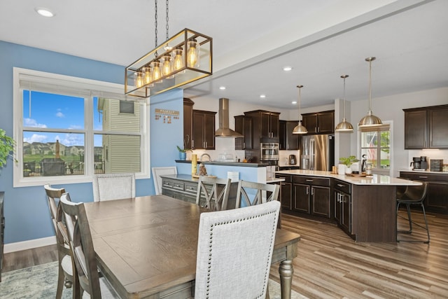 19281 Blue Stem Ct, Maple Grove, MN 55311 - dining area featuring wood finished floors, recessed lighting, a chandelier, and baseboards