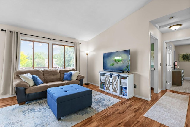 2708 94th Ave N, Brooklyn Park, MN 55444 - living area featuring wood finished floors, baseboards, and vaulted ceiling
