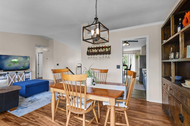 2708 94th Ave N, Brooklyn Park, MN 55444 - dining area with wood finished floors, a chandelier, ceiling fan, baseboards, and ornamental molding